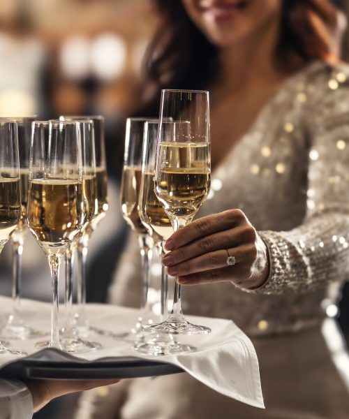 A,Bartender,Holds,A,Plate,With,Pink,Champagne,And,A